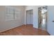 Bedroom features laminate flooring and a closet for storage at 8010 W Adam Ave, Peoria, AZ 85382