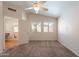 Bedroom with neutral carpet, ceiling fan, and two windows at 8010 W Adam Ave, Peoria, AZ 85382