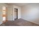 Bedroom features carpeted floor and a closet for storage at 8010 W Adam Ave, Peoria, AZ 85382