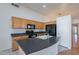 Kitchen showcasing black appliances, lots of counter space, and wood cabinets at 8010 W Adam Ave, Peoria, AZ 85382