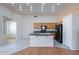 Kitchen featuring an island with sink and black appliances at 8010 W Adam Ave, Peoria, AZ 85382