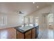 Kitchen island features a white sink with views of the backyard at 8010 W Adam Ave, Peoria, AZ 85382