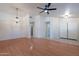 Spacious living room with wood floors, high ceilings, and modern lighting at 8010 W Adam Ave, Peoria, AZ 85382