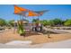 Community playground shaded by canopies, featuring slides, climbing structures, and play areas at 8010 W Adam Ave, Peoria, AZ 85382