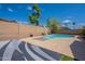 Sparkling pool surrounded by lush landscaping and privacy fencing at 8010 W Adam Ave, Peoria, AZ 85382