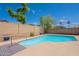 Backyard pool provides a refreshing escape and is surrounded by lush landscaping at 8010 W Adam Ave, Peoria, AZ 85382