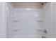 Clean white shower/tub combo with built in shelves in well maintained condition at 8010 W Adam Ave, Peoria, AZ 85382