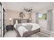 Bright and airy main bedroom featuring a ceiling fan, stylish decor, and plenty of natural light at 8220 E Crestwood Way, Scottsdale, AZ 85250