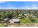 Aerial view of a home and land with horse facilities at 944 E Melody Dr, Gilbert, AZ 85234