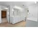 Spacious bathroom featuring a double vanity, ample storage, and adjacent toilet room at 944 E Melody Dr, Gilbert, AZ 85234