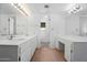 Well-lit bathroom offering double sinks, mirrors, and a vanity area for added convenience at 944 E Melody Dr, Gilbert, AZ 85234