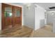 Inviting foyer with wood-look floors and double doors at 944 E Melody Dr, Gilbert, AZ 85234