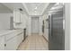 Clean kitchen featuring white cabinets and stainless steel refrigerator at 944 E Melody Dr, Gilbert, AZ 85234