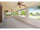 Sunroom with large windows that offer beautiful views of the pool and greenery at 944 E Melody Dr, Gilbert, AZ 85234