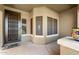 Inviting front porch featuring a secure screen door and a cozy seating area with ample natural light at 1115 E Locust Dr, Chandler, AZ 85286