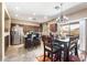 Open-concept kitchen with stainless steel appliances, granite countertops, and an island with seating at 1115 E Locust Dr, Chandler, AZ 85286