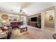 Spacious living room with a large television, comfortable seating, and plenty of natural light at 1115 E Locust Dr, Chandler, AZ 85286