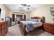 Primary bedroom boasts a spacious layout, bay window, and a ceiling fan for added comfort at 1115 E Locust Dr, Chandler, AZ 85286