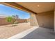 Backyard featuring a patio area and gravel landscape with lush plants, offering a tranquil outdoor oasis at 1239 E Elaine St, Casa Grande, AZ 85122