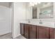 Bathroom featuring a double sink vanity and a large mirror at 1239 E Elaine St, Casa Grande, AZ 85122