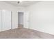 Bright bedroom featuring neutral walls, carpet, and closet with a doorway for flexible space at 1239 E Elaine St, Casa Grande, AZ 85122