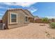 Single-story home featuring a low maintenance yard and covered patio at 1239 E Elaine St, Casa Grande, AZ 85122