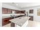 Beautiful kitchen with dark cabinets, granite countertops, and stainless steel appliances at 1239 E Elaine St, Casa Grande, AZ 85122