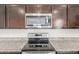 Close up of the kitchen with stainless steel appliances and granite countertops at 1239 E Elaine St, Casa Grande, AZ 85122