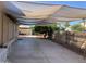 Spacious covered patio, perfect for outdoor entertaining and relaxation, offers ample space and shade at 13031 W Surrey Ave, El Mirage, AZ 85335