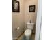The bathroom features a standard toilet, neutral walls, and tiled floors at 13031 W Surrey Ave, El Mirage, AZ 85335