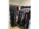 This walk-in closet has ample hanging storage for clothing, and overhead storage at 13031 W Surrey Ave, El Mirage, AZ 85335