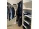 This closet features ample storage including shelving and hanging storage at 13031 W Surrey Ave, El Mirage, AZ 85335
