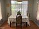 Charming dining room with floral accents, providing a cozy atmosphere at 13031 W Surrey Ave, El Mirage, AZ 85335