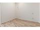 Empty bedroom with ceiling fan, light wood floors, and neutral walls with plenty of outlets at 13821 N Thunderbird Blvd, Sun City, AZ 85351