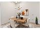 Dining room with chandelier, dining table and chairs, decorative rug, and a modern design at 13821 N Thunderbird Blvd, Sun City, AZ 85351