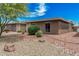 Charming single-story home with desert landscaping, rock ground cover, and a beautiful blue sky at 13821 N Thunderbird Blvd, Sun City, AZ 85351