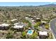 Aerial view of desert community with multiple homes and a community pool at 13850 N Mirage Heights Ct # 201, Fountain Hills, AZ 85268