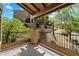 Outdoor patio with views of lush trees, flowering shrubbery and nearby building at 13850 N Mirage Heights Ct # 201, Fountain Hills, AZ 85268