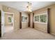 Large bedroom with a view of a green belt from two windows with plantation shutters at 13850 N Mirage Heights Ct # 201, Fountain Hills, AZ 85268