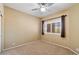 Bedroom featuring neutral carpet, modern fan and a window with light-blocking shutters at 13850 N Mirage Heights Ct # 201, Fountain Hills, AZ 85268