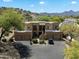 Beautiful desert home with neutral colors and desert landscaping, including a private drive and mountain views at 13850 N Mirage Heights Ct # 201, Fountain Hills, AZ 85268