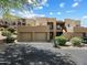 Desert home featuring a private two-car garage, neutral paint, private entrance and beautiful desert landscaping at 13850 N Mirage Heights Ct # 201, Fountain Hills, AZ 85268
