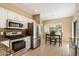 Kitchen featuring stainless steel appliances, granite countertops, and an eat-in area at 13850 N Mirage Heights Ct # 201, Fountain Hills, AZ 85268