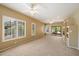 Spacious living room with neutral carpet, recessed lighting, and a ceiling fan at 13850 N Mirage Heights Ct # 201, Fountain Hills, AZ 85268