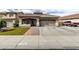 Inviting single-story home featuring a well-maintained yard, a two car garage, and a cozy front entrance at 14282 W Indianola Ave, Goodyear, AZ 85395