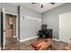 Flexible room features modern fixtures, ceiling fan, and wood-look tile at 14282 W Indianola Ave, Goodyear, AZ 85395