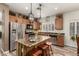 Well-equipped kitchen with stainless appliances, island seating, and ample cabinet space at 14282 W Indianola Ave, Goodyear, AZ 85395