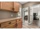Wood cabinetry in a kitchen area showing an entry to a bedroom and living room at 14282 W Indianola Ave, Goodyear, AZ 85395