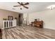 Bright living room with plenty of natural light, stylish floors and a piano at 14282 W Indianola Ave, Goodyear, AZ 85395