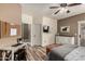 Comfortable main bedroom features a work space, warm colors, and outside access at 14282 W Indianola Ave, Goodyear, AZ 85395